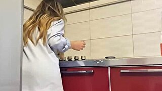 Gorgeous woman cleans the stove and masturbates her big ass.