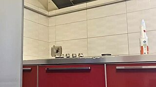Gorgeous woman cleans the stove and masturbates her big ass.