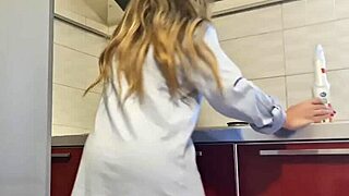 Gorgeous woman cleans the stove and masturbates her big ass.