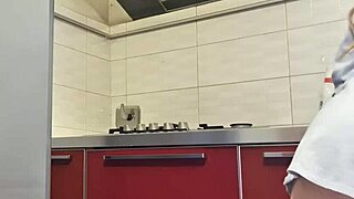 Gorgeous woman cleans the stove and masturbates her big ass.