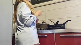 Gorgeous woman cleans the stove and masturbates her big ass.
