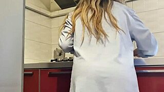 Gorgeous woman cleans the stove and masturbates her big ass.