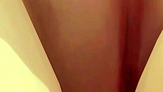 topless girl poses on beach lifting skirt to show big ass and tits