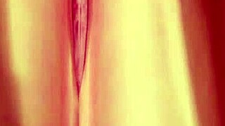 topless girl poses on beach lifting skirt to show big ass and tits