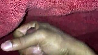 Feeling aroused masturbating and giving handjob while watching black porn on xvideos
