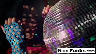 romi plays with a disco ball before stuffing toying her pussy