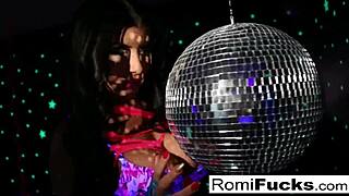 romi plays with a disco ball before stuffing toying her pussy