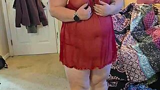 bbw in lingerie doing a sexy striptease.