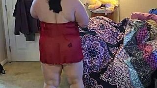 bbw in lingerie doing a sexy striptease.