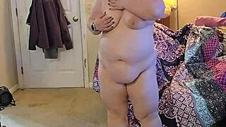 bbw in lingerie doing a sexy striptease.
