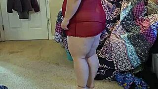 bbw in lingerie doing a sexy striptease.