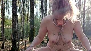 female slave self-spanking outdoors in public exposure