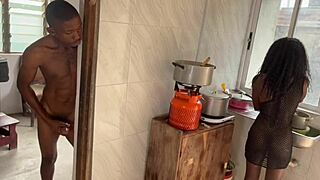 Big black cock makes pussy squirt in the kitchen.