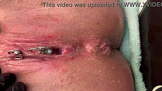 Pierced clit rubbed hard in latex gloves with intense pee stream