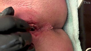 Pierced clit rubbed hard in latex gloves with intense pee stream