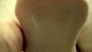 Titty slut feels intense pleasure fingering her pussy with a dildo while watching porn