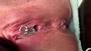 Pierced clit rubbed hard in latex gloves with intense pee stream