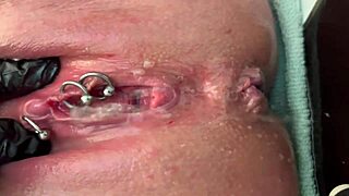 Pierced clit rubbed hard in latex gloves with intense pee stream