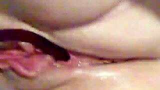 Wife plunges toy into dripping squirting pussy