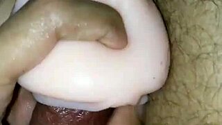 Intensely masturbating with jumbo cup to cum.