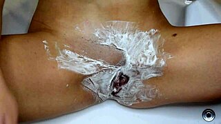 she does an unshaven pussy shaving close up in the bathroom, clothes ripped for kinky fun