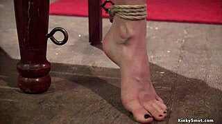 Busty lesbian gets whipped and fucked in domination scene.