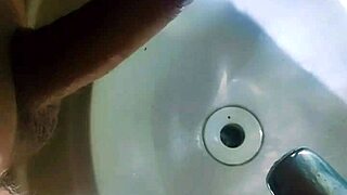 Hidden man in the bathtub sink completely removing seed