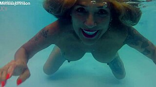 Melissa The Mermaid Swims In Pool With Brown Eyes And Tattoo