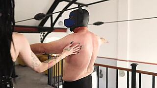 British goth teases in latex and fishnets in bedroom.