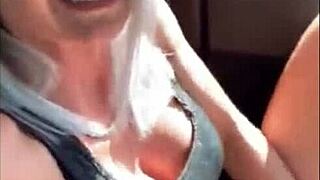 Amazing blonde enjoys fingering to orgasm in public car setting