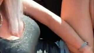 Amazing blonde enjoys fingering to orgasm in public car setting