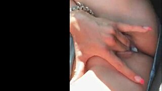Amazing blonde enjoys fingering to orgasm in public car setting