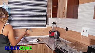Curvy ebony stepmom cooks in kitchen with small waist and sexy moves