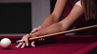 Stepmom instructs her stepdaughter on playing billiard skillfully