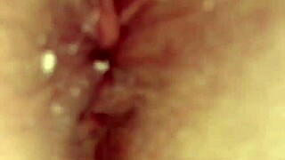 a redhead with hairy pussy pees through her red hair in this intimate scene