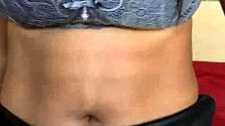 the ebony milf starts playing with her vibrator, getting wet before peeing on herself