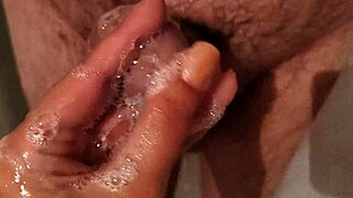 My hot stepbrother groped me in the shower, giving taboo pleasure with moaning handjob while his wife is away