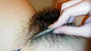 Pretty amateur shows hairy bush underwater in pool close up