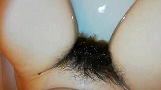 Pretty amateur shows hairy bush underwater in pool close up