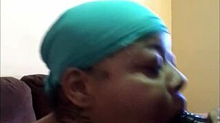 Sucking smoked sausage in fetish blowjob scene.