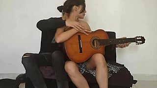 mi stepsister is horny and wants me to masturbate her while i play guitar