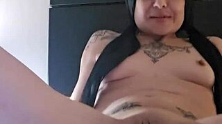 emy angel gently touches and rubs her toy