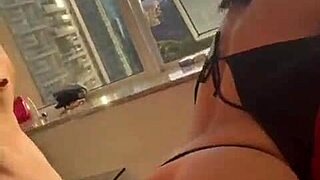 Couple fucks passionately in the building window, letting neighbors watch every thrust and moan.