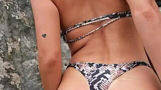 hottie flashing boobs in sexy bikini at the beach.