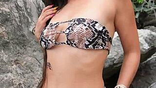 hottie flashing boobs in sexy bikini at the beach.