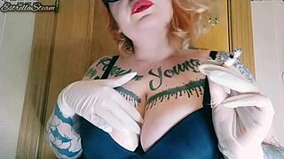 This chubby spanish babe with tattoos smokes while wearing gloves at home.