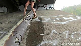 Kitty performs a solo pissing scene outdoors in public