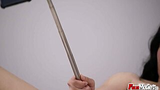 Brunette Bitch Fucks Selfie Stick with Shaved Pussy and Natural Tits