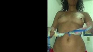 Teasing in a red bikini by the pool.