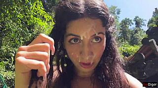 she gets cum on her face in the public locker room, then walks to the waterfall covered in it.